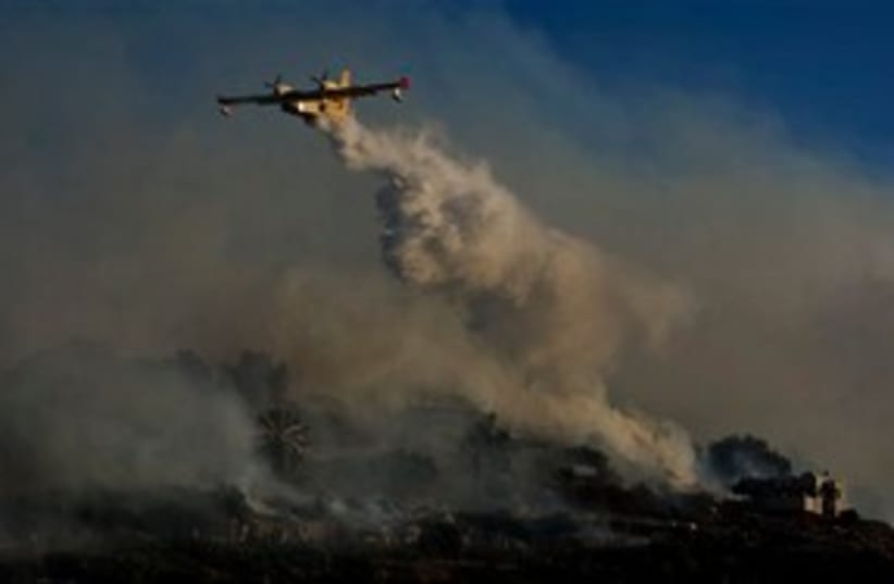 Water dropping fire fighting plane 311 AP (photo credit: AP)