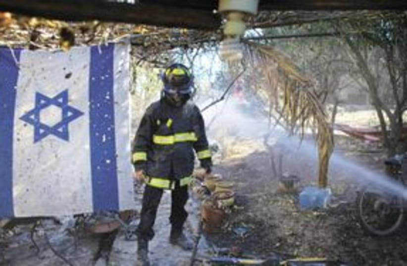 Firefighter Israel Flag 311 (photo credit: Associated Press)