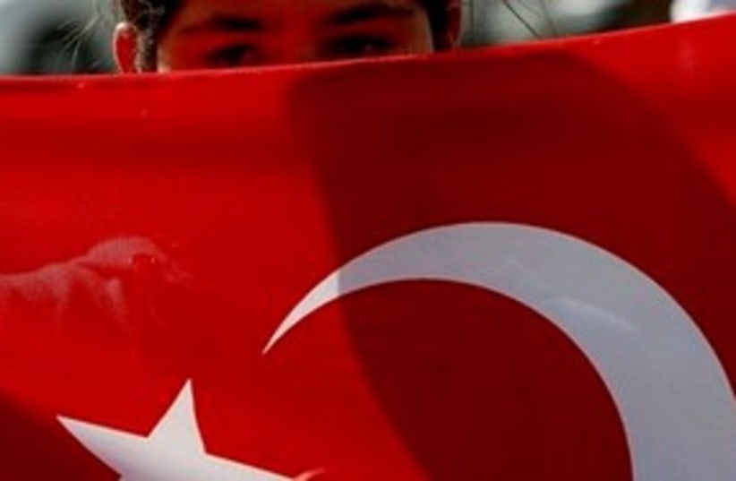 Child holding Turkish flag 311 AP (photo credit: AP)