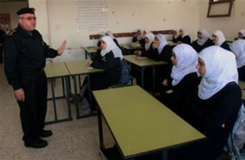 Hamas official with Gazan schoolgirls 311 AP (photo credit: AP)