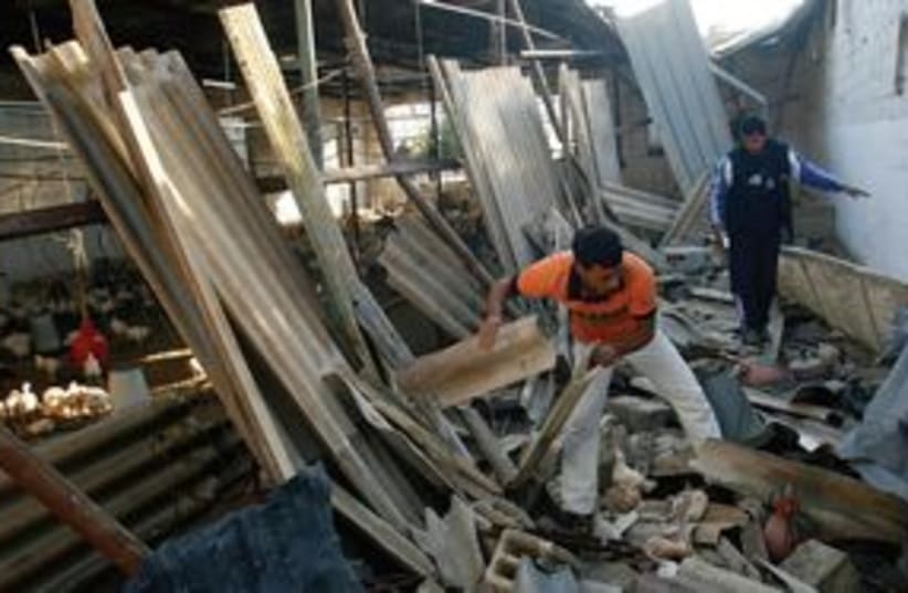 Gazan clears rubble 311 AP (photo credit: AP)