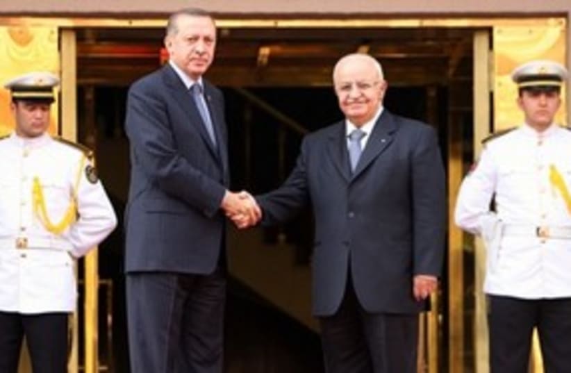 Erdogan, Syrian counterpart shaking hands 311 (photo credit: AP Photo/Burhan Ozbilici)