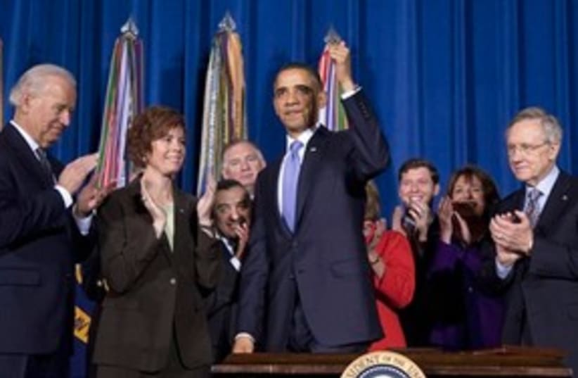 Obama thumbs up smiling 311 (photo credit: AP Photo/Evan Vucci)