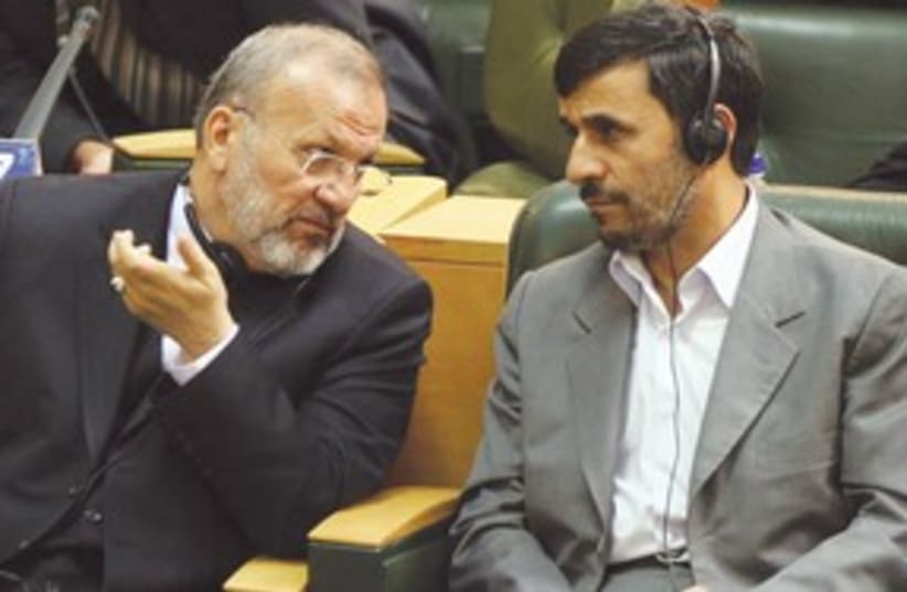 Ahmadinejad, Manouchehr Mottaki talking 311 (photo credit: AP)