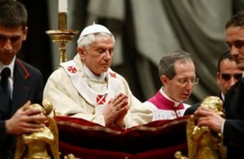 Pope, eyes closed, praying at Christmas 311 (photo credit: AP Photo/Andrew Medichini)