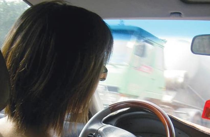 Woman driving 521 (photo credit: Illustrative photo)