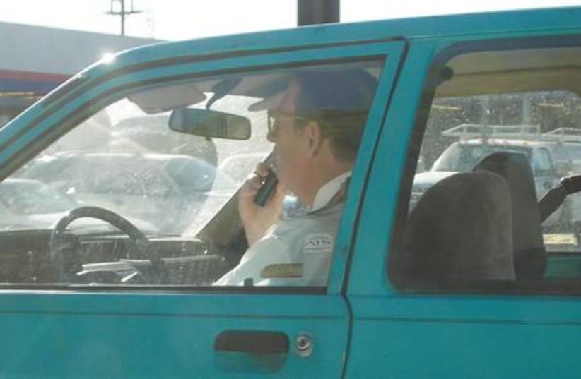 Shaving in car driving 521 (photo credit: Courtesy)