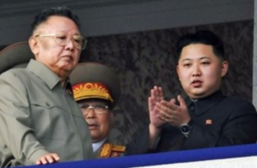 Kim Jong Il looking serious 311 (photo credit: AP Photo/Kyodo News)