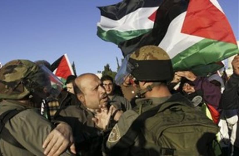 IDF soldiers and Palestinian at protest near Ramallah 311 (photo credit: AP)