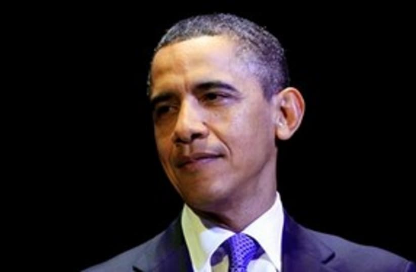 Obama looking smug with black background 311 (photo credit: AP Photo/Carolyn Kaster)