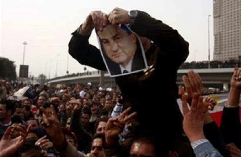Mubarak picture ripped 311 (photo credit: Associated Press)