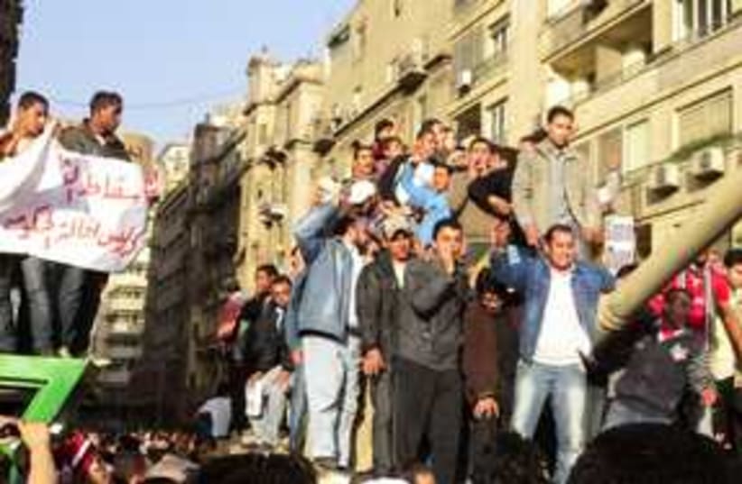 Egyptian protesters on tank 311 (photo credit: MELANIE LIDMAN)