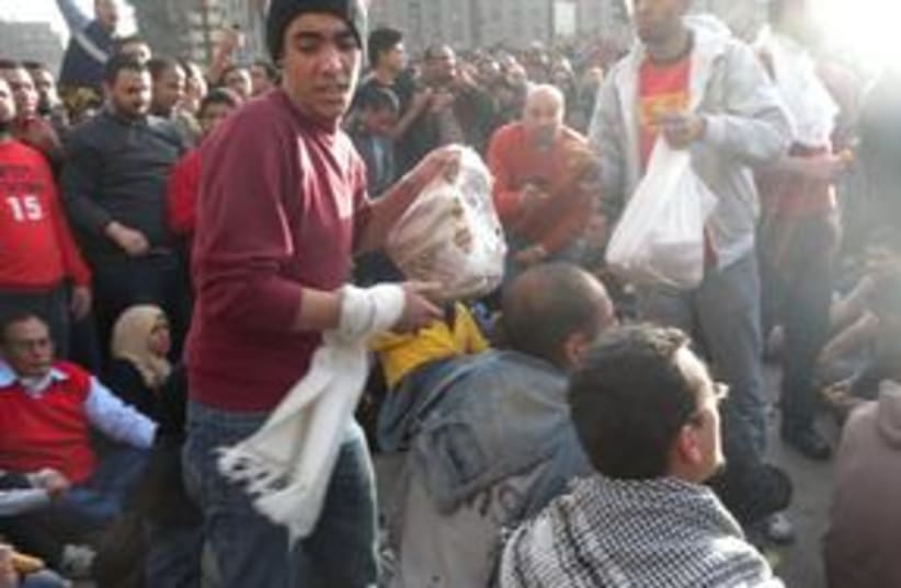 Egyptian rioters with pita 311 (photo credit: MELANIE LIDMAN)