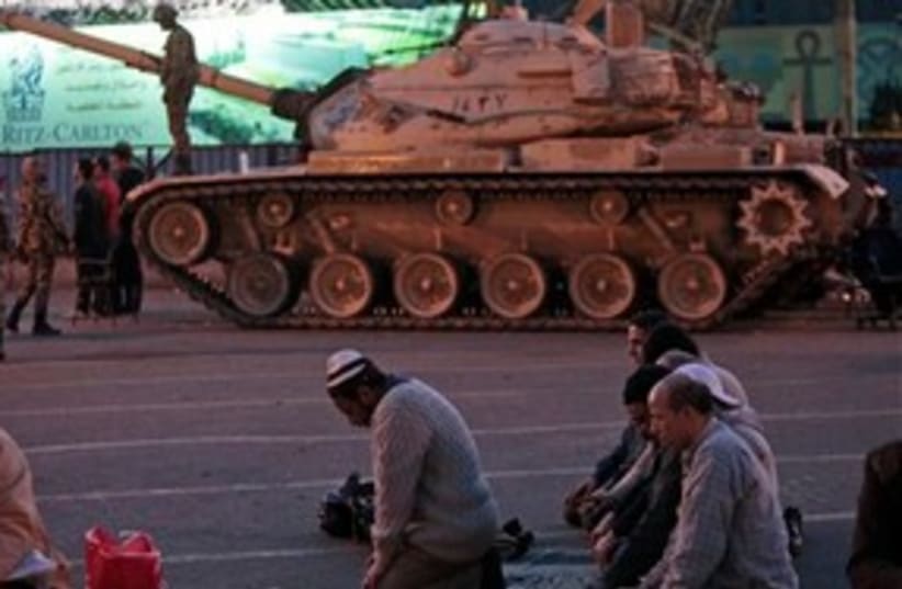 Egpyt tank pray protest Cairo Tahrir 311 AP (photo credit: AP)