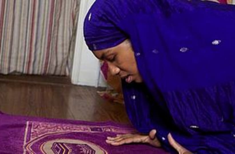 muslim woman prayer hijab 311 (photo credit: Associated Press)