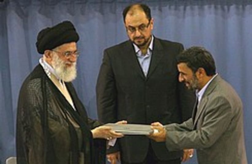 Mahmoud Ahmadinejad receives the presidential decr (photo credit: AP)