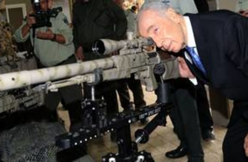 Peres with big gun 311 (photo credit: Courtesy)