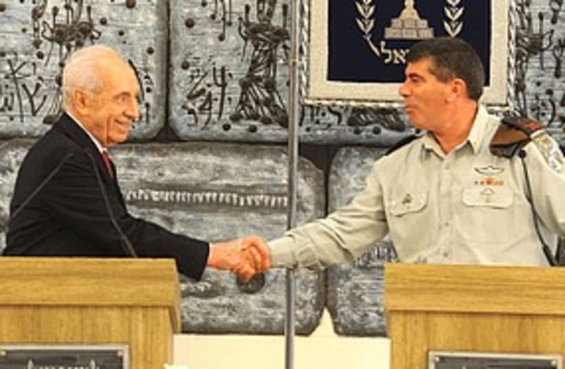 Ashkenazi Peres shaking hands 311 (photo credit: Beit Hanassi)