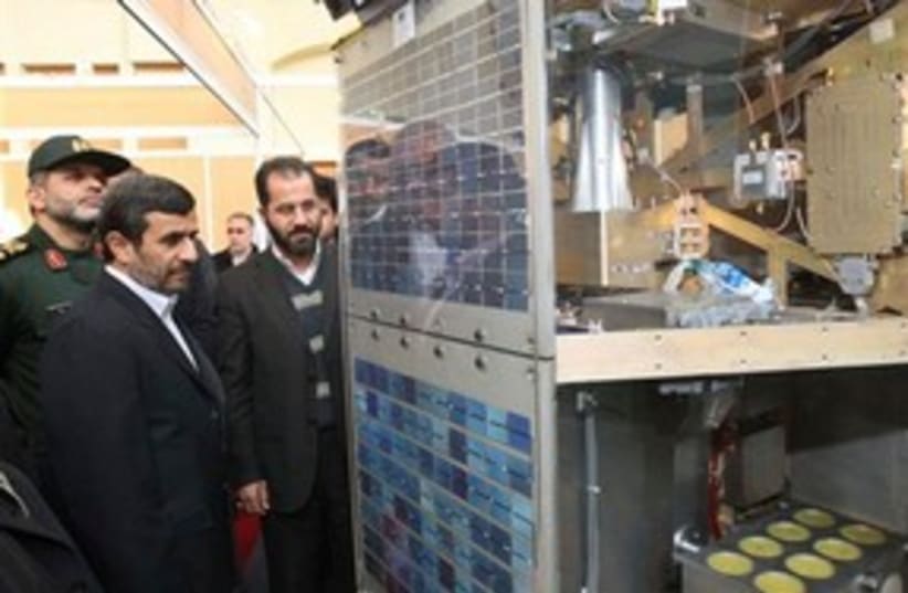 Ahmadinejad with satellites 311 AP (photo credit: AP)
