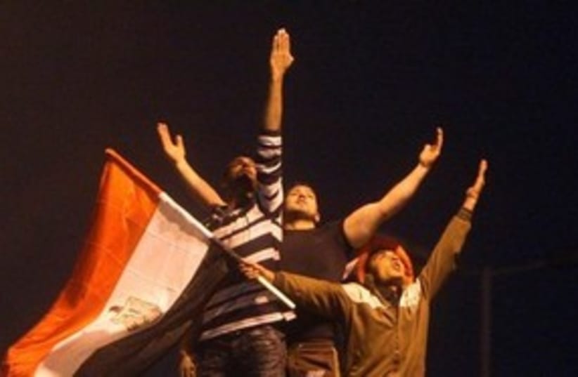 Celebrations  pose Tahrir Square Egypt 311 AP (photo credit: AP)