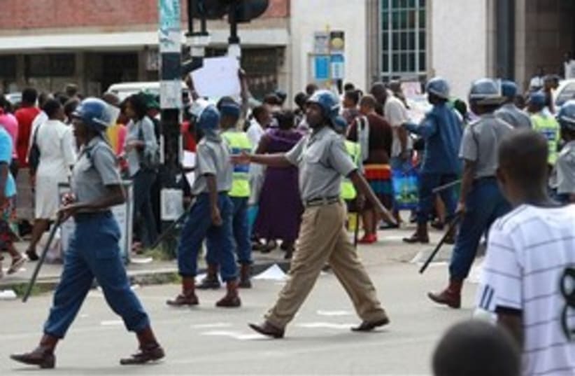 Zimbabwe riot police 311 AP (photo credit: AP)