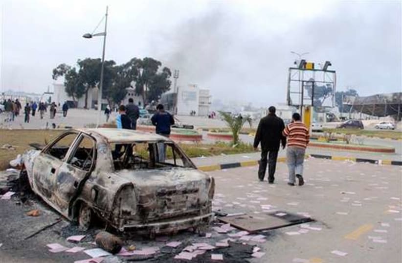 Libya  burnt  car 520 (photo credit: Associated Press)