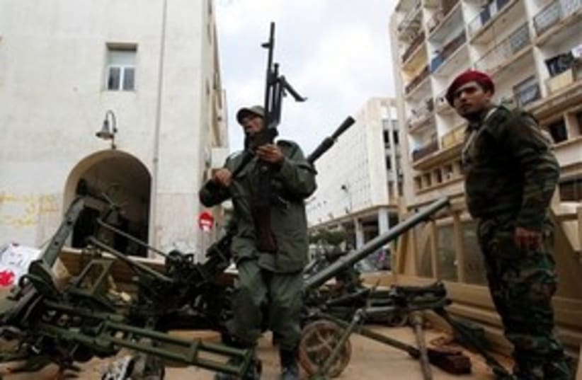 Anti-Gaddafi gunmen in Libya 311 AP (photo credit: AP)