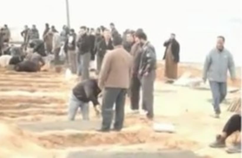 mass graves Libya_311 (photo credit: Still from video by OneDayOnEarth.org.)