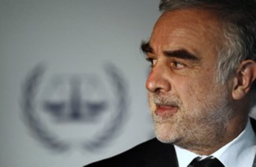 Former ICC chief Luis Moreno-Ocampo (R) 311 (photo credit: Jerry Lampen / Reuters)
