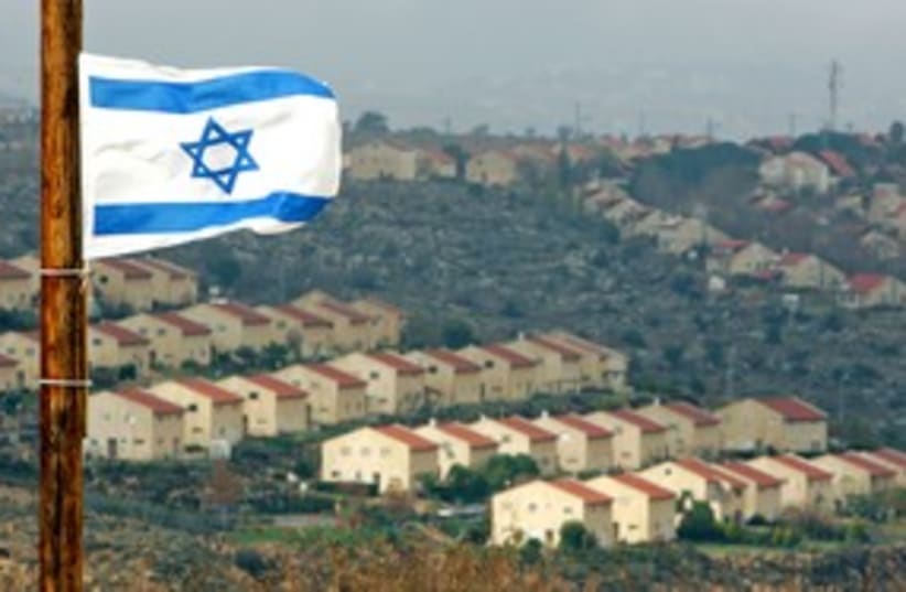 Israeli flag flutters over settlement of Ofra 311 R (photo credit: Laszlo Balogh / Reuters)