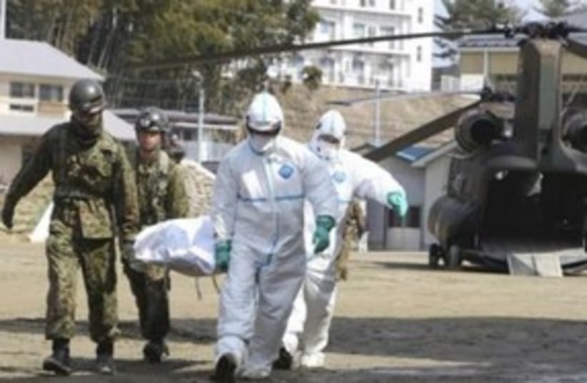 Japanese victime suspected of radiation exposure 311 R (photo credit: REUTERS/Yomiuri Shimbun)