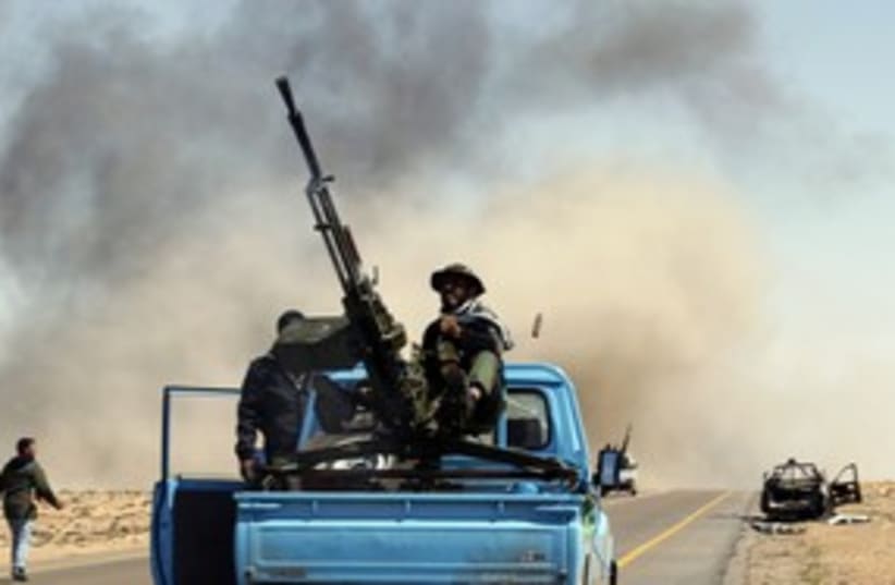 brega fighting in libya_311 reuters (photo credit: Goran Tomasevic / Reuters)