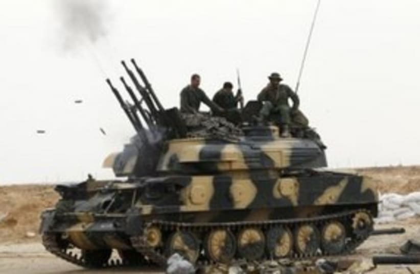 Libyan Soldiers Tank 311 (R) (photo credit: REUTERS)