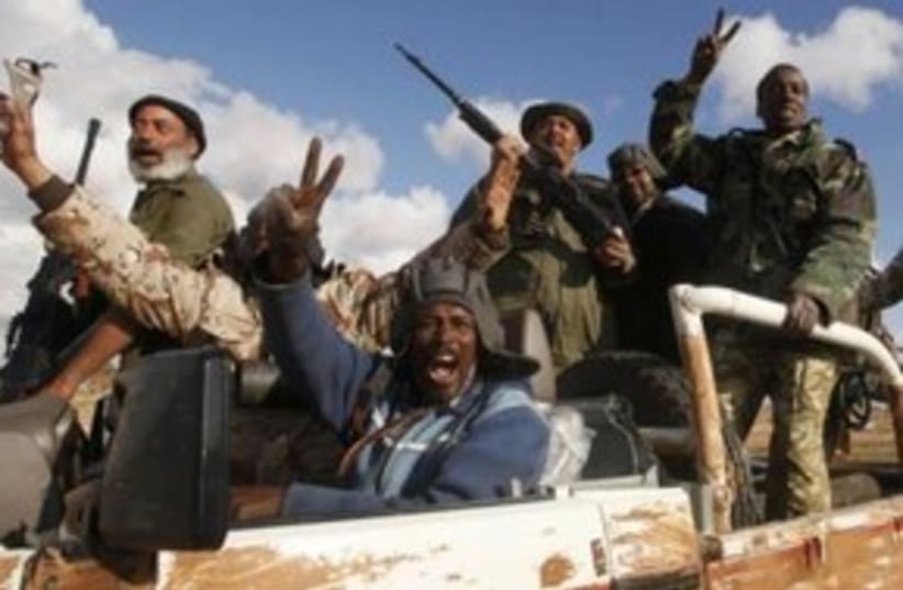 Libyan rebels celebrate 311 (R) (photo credit: REUTERS/Suhaib Salem)