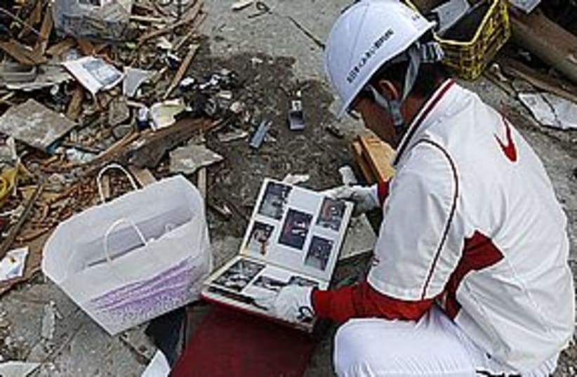 japan rubble sad 311 (photo credit: REUTERS)