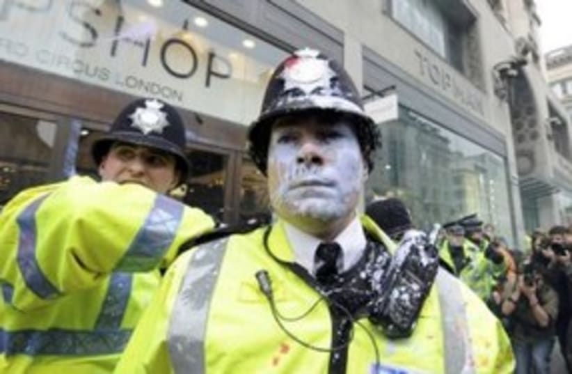 London policeman with paint on face (photo credit: REUTERS/Paul Hackett )