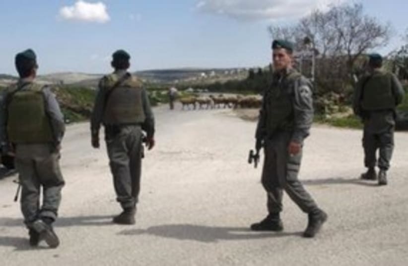 Border Police officers in the West Bank town Awarta 311 (R) (photo credit: REUTERS/Abed Omar Qusini)