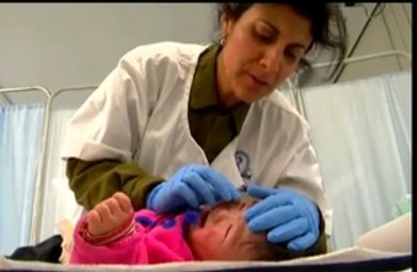 IDF delegation in Japan treats baby_311 (photo credit: IDF Spokesperson)