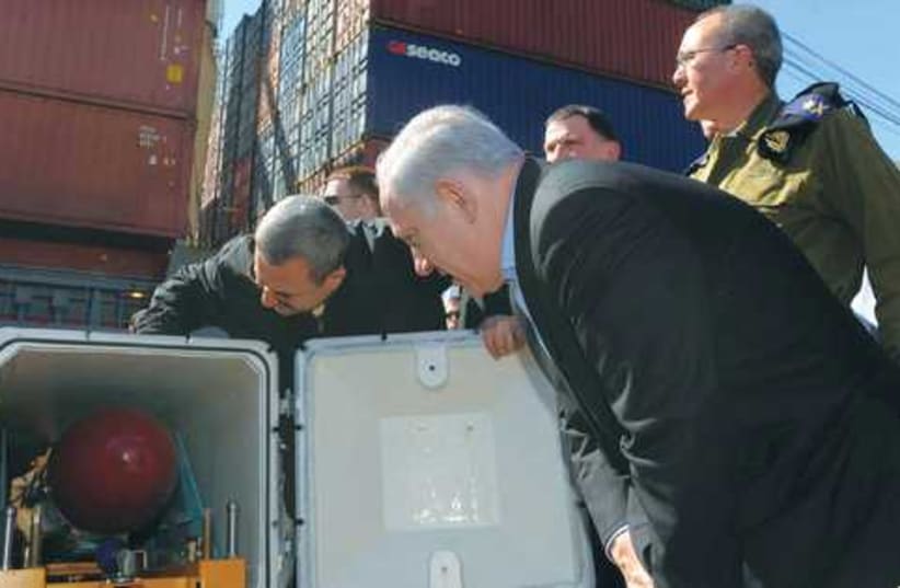 Ehud Barak and Benjamin Netanyahu examine missile (photo credit: Avi Ohayon/GPO/FLASH90)