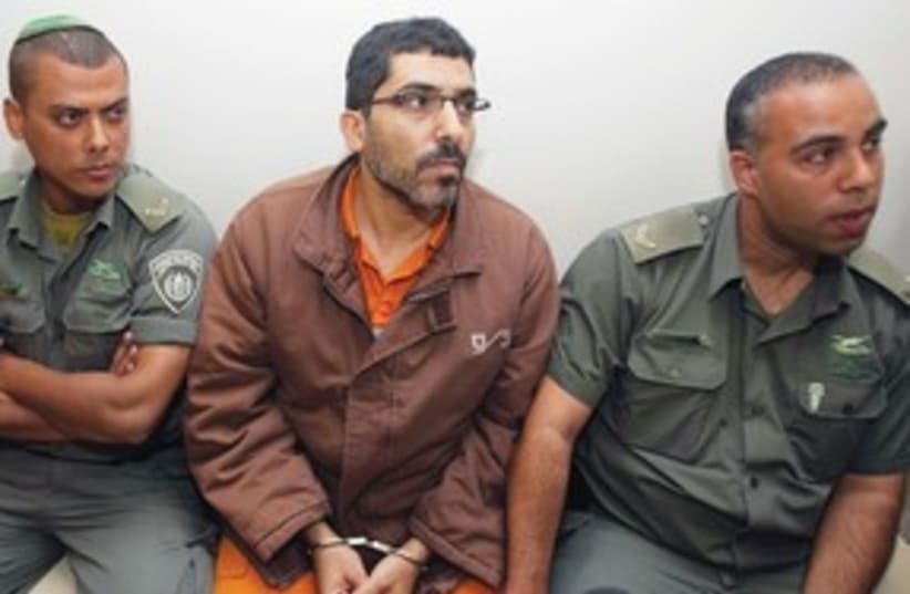 Palestinian engineer Dirar Abu Sis in court 311 (R) (photo credit: Baz Ratner/Reuters)