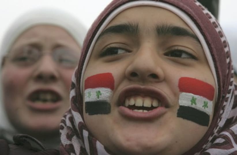 syrian protester_521 (photo credit: MAJED JABER / REUTERS)