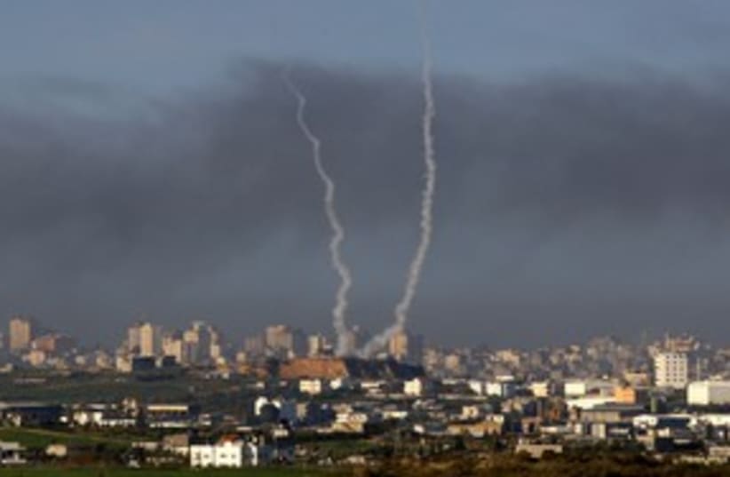 Smoke trails from rockets being fired in Gaza 311 (R) (photo credit: Yannis Behrakis / Reuters)