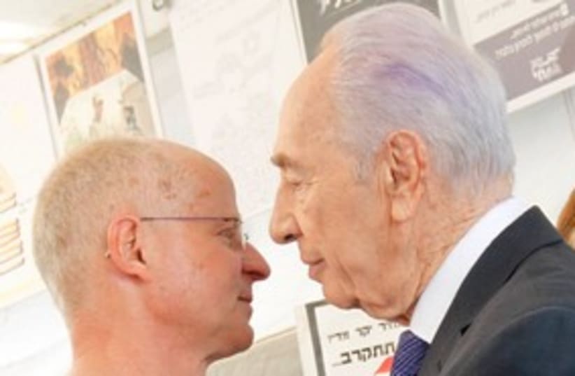 Noam Schalit and Peres about to kiss 311 (photo credit: Meital Jaslovitz  )