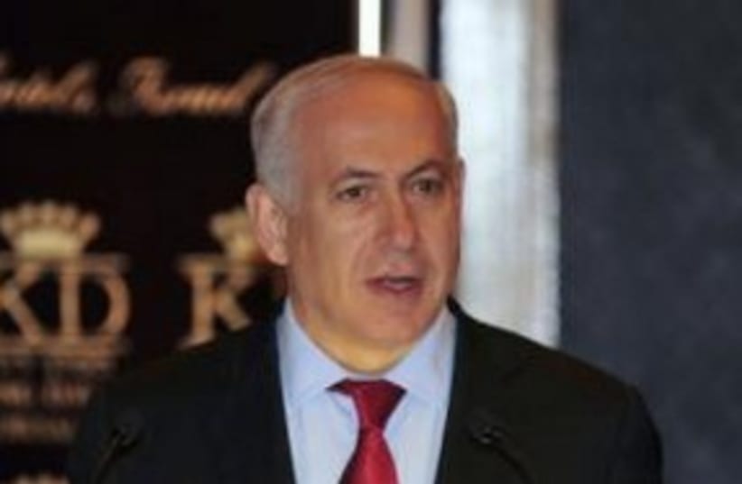 Prime Minister Binyamin Netanyahu open mouth 311 (R) (photo credit: REUTERS/Yin Dongxun)