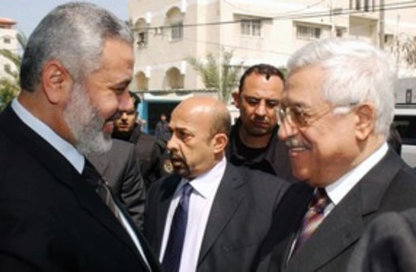 PA President Abbas with Hamas PM Ismail Haniyeh 311 (R) (photo credit: REUTERS/Abd Alhalim Abu Aska)