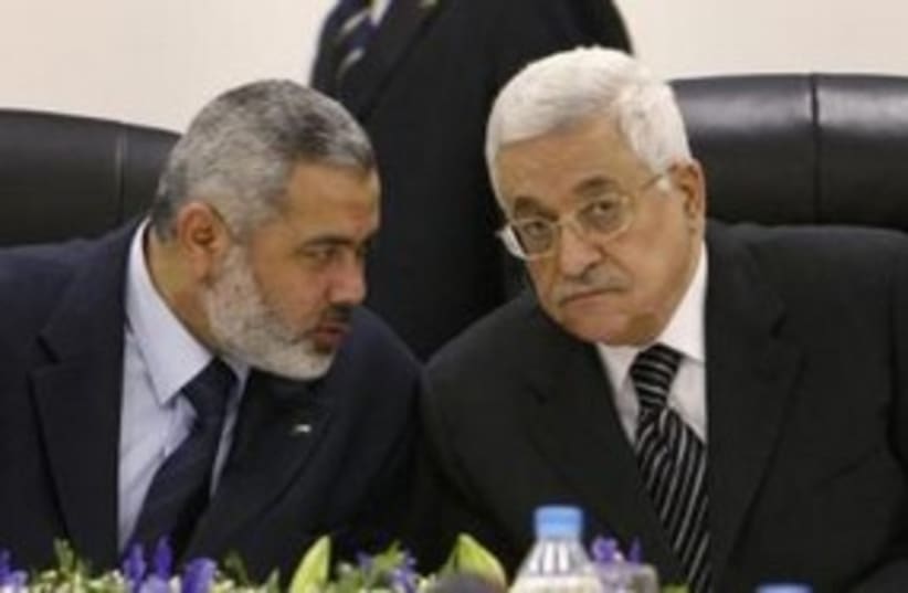 PA President Abbas with Hamas PM Haniyeh 311 (R) (photo credit: REUTERS/Suhaib Salem)