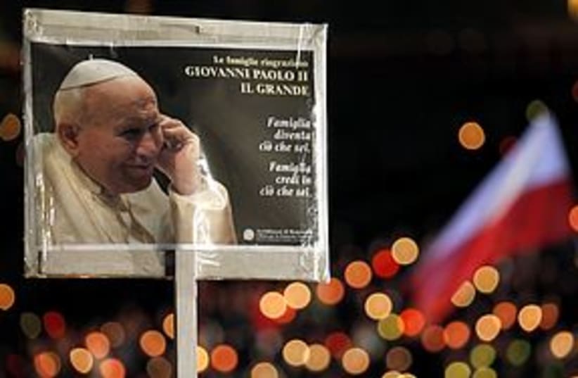 Pope John Paul poster 311 (photo credit: REUTERS/Alessia Pierdomenico)