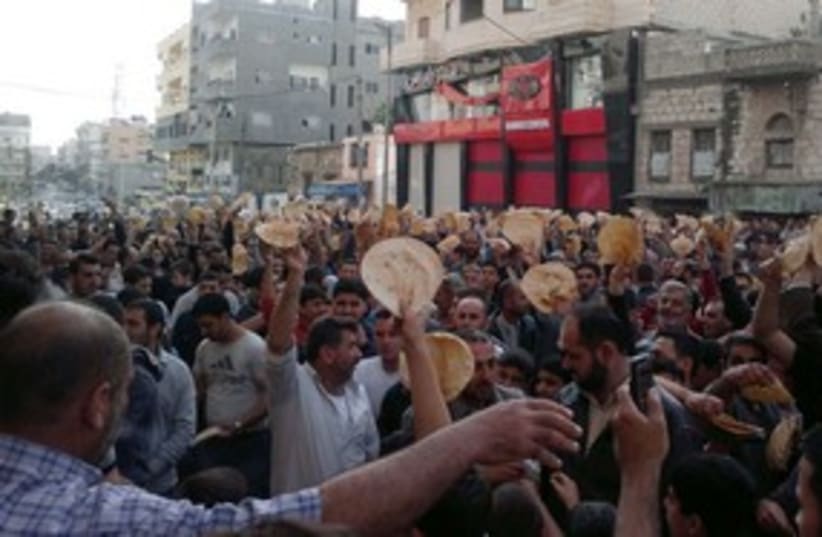 Syria bread protest Banias 311 R (photo credit: Reuters)