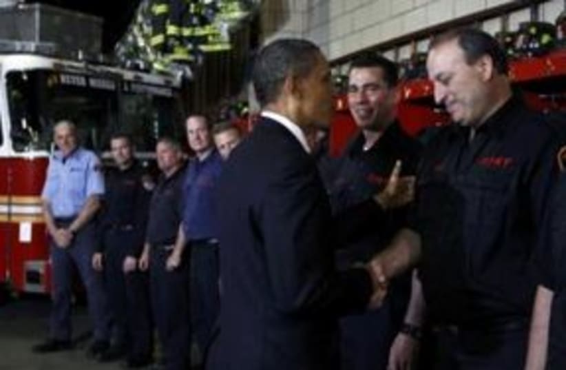 US President Barack Obama at NY firehouse 311 (R) (photo credit: REUTERS/Kevin Lamarque)