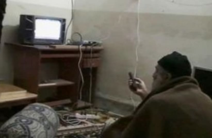 Bin Laden watches TV 311 (photo credit: REUTERS)